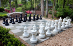 Extra large black and white chess pieces on the yard