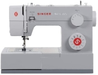 White and red sewing machine labeled Singer