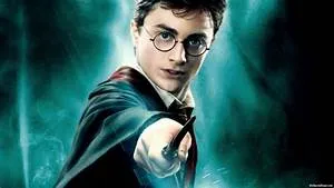 Harry Potter holding a wand out in front of him.
