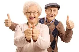 A senior citizen man and woman with thumbs up.
